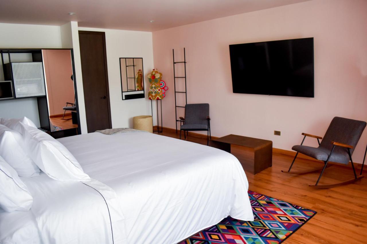 Hotel V1501 Pasto Buitenkant foto A room at the hotel