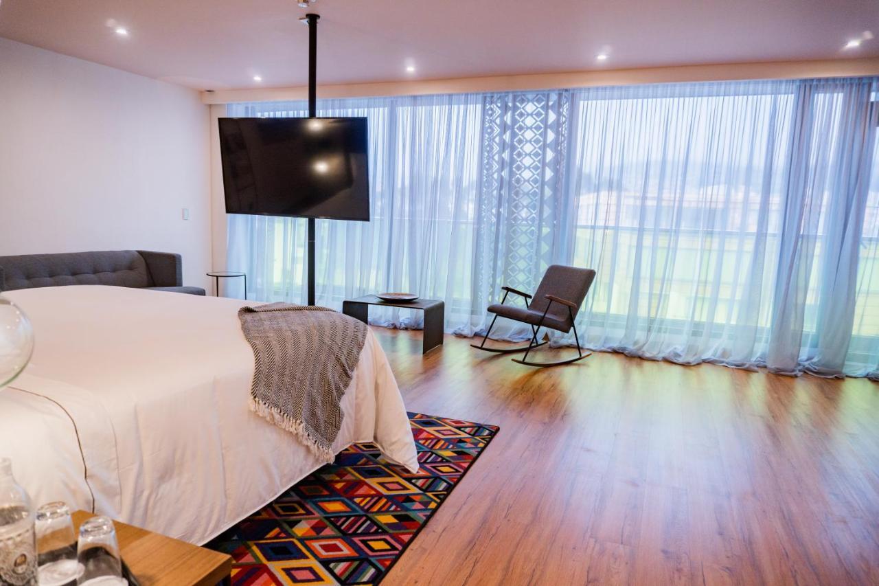 Hotel V1501 Pasto Buitenkant foto A bedroom at the hotel