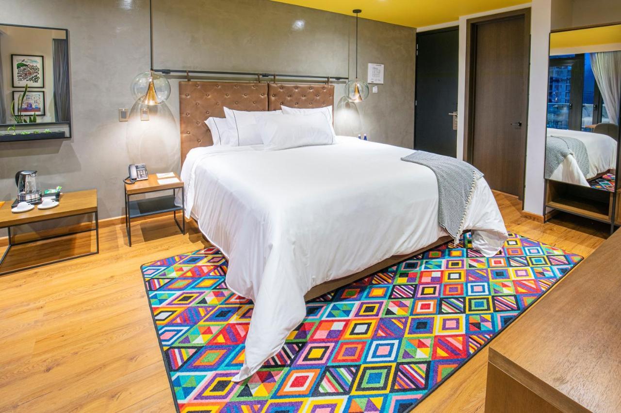 Hotel V1501 Pasto Buitenkant foto A carpet in a bedroom