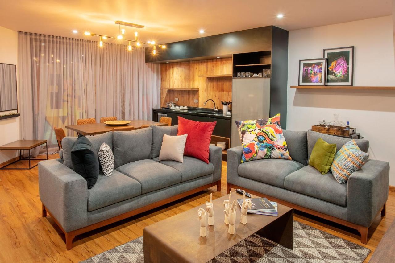 Hotel V1501 Pasto Buitenkant foto A living room with a sofa