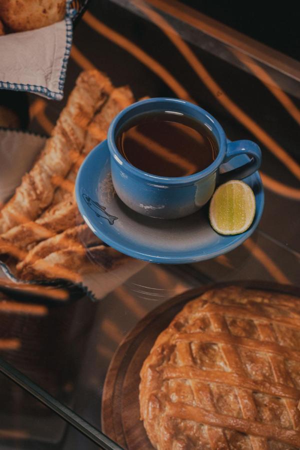 Hotel V1501 Pasto Buitenkant foto A cup of coffee with a slice of lime